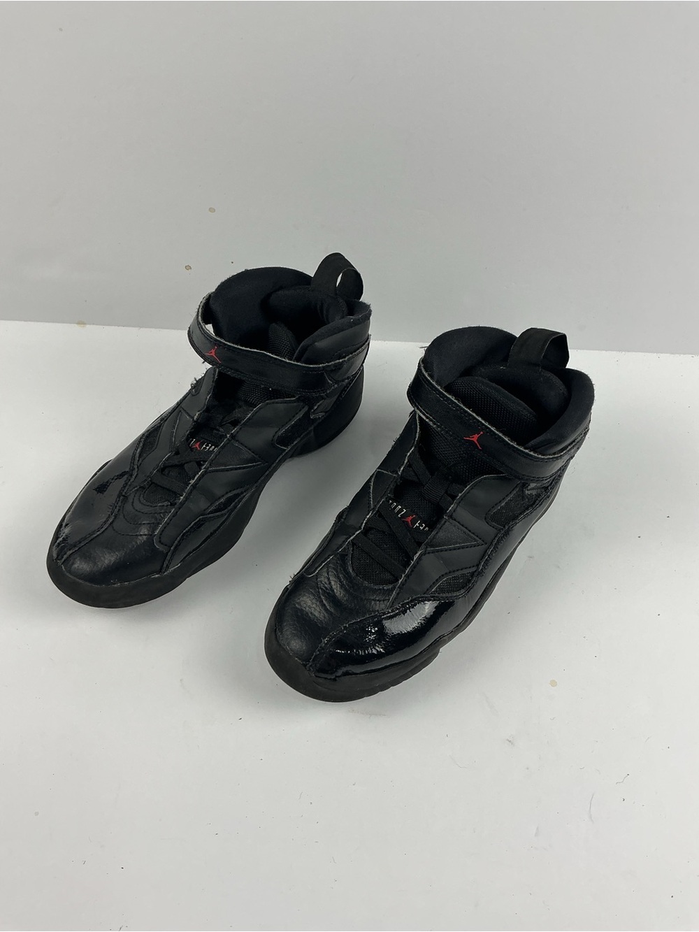 Jordan Black Kids' High-Top Sneakers with Red Jumpman Accents they need inserts